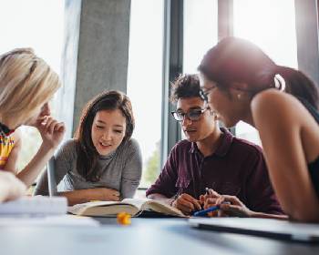 Home Two httpselements.envato.comgroup of young people sitting at table reading boo p6getxu 1.jpg