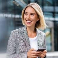 Contact httpselements.envato.comhappy young businesswoman with mobile phone in the j25jkul.jpg